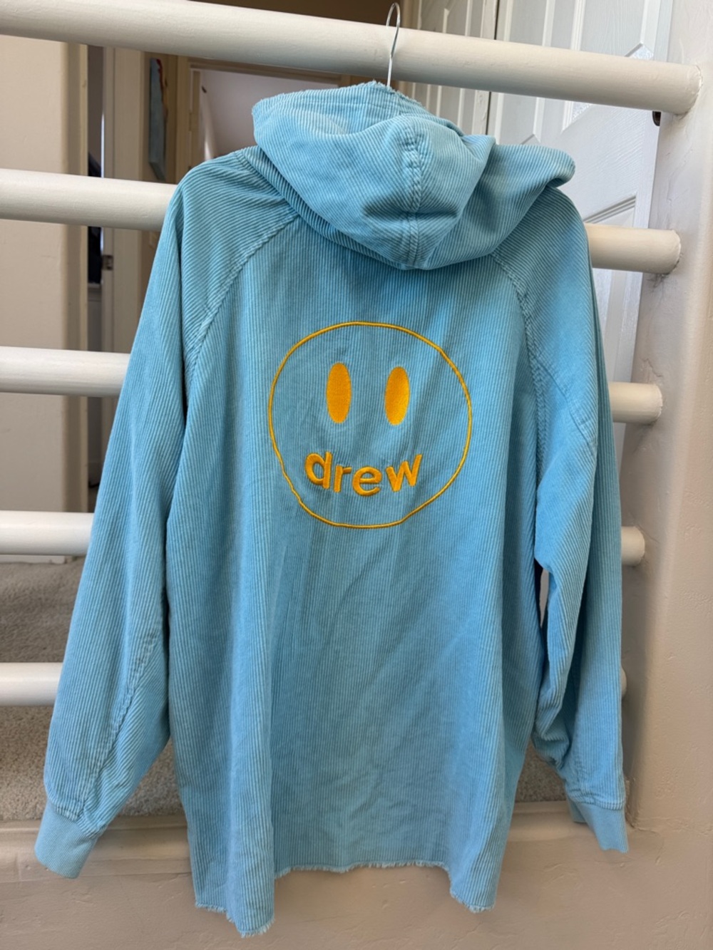 drew house blue corduroy hoodie with yellow smile logo